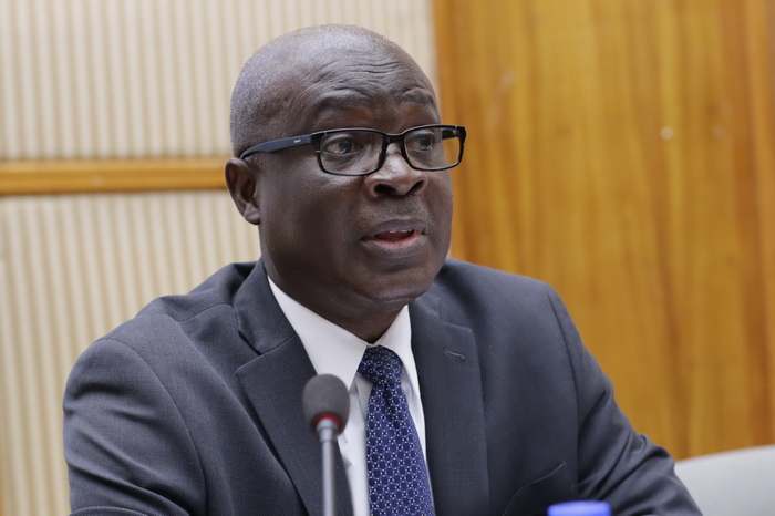 Mr Michael Ayesu (inset), a representative of Ministry of Finance, making a contribution at the dialogue